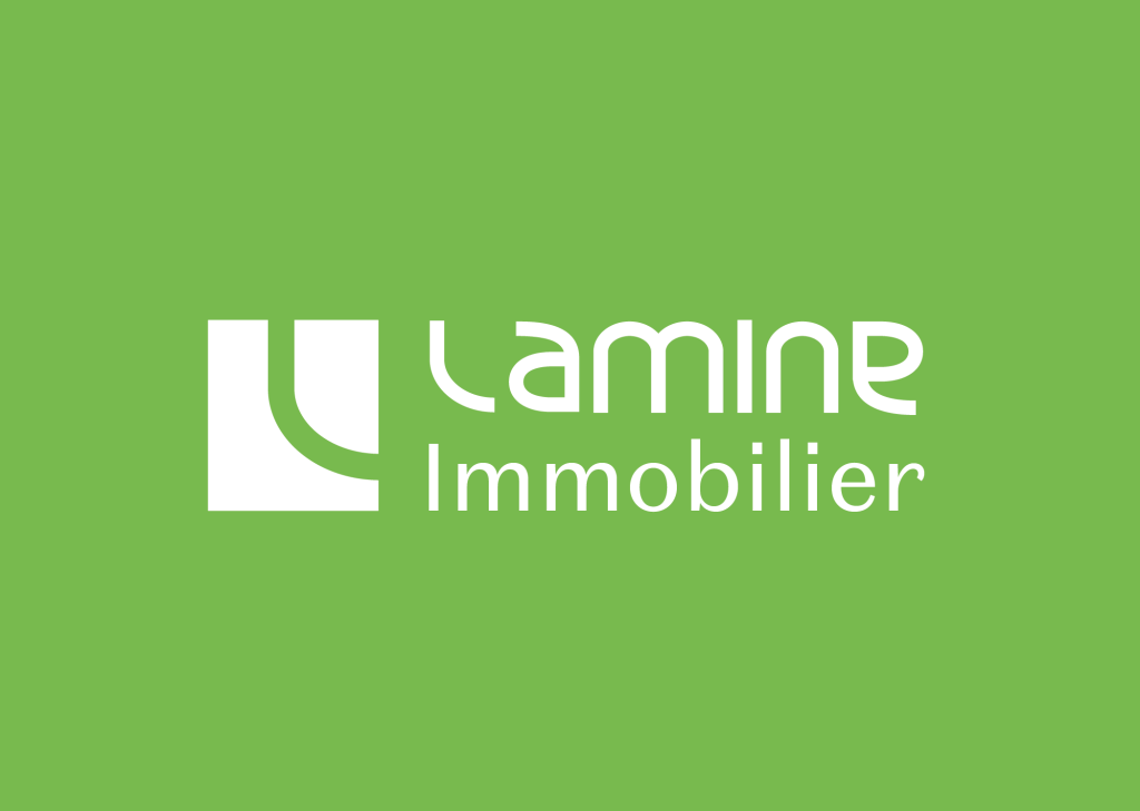 Lamine real estate logo white on green background